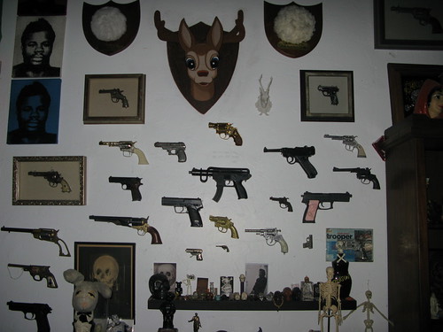 Gun collection on display at dude's apartment