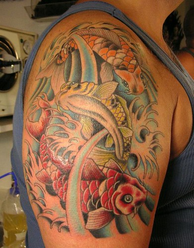 koi sleeve tattoo. 3 koi - the first of a sleeve