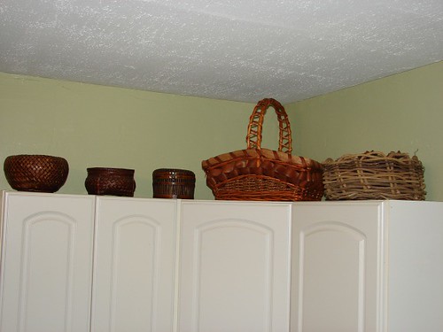baskets on top of the cabinets