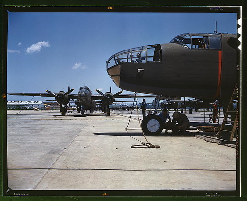Warbird picture - New B-25 bombers lined up for final inspection and tests at the flying field of an aircraft plant, North American Aviation, Inc., Calif. It performs at the 25,000-foot ceiling