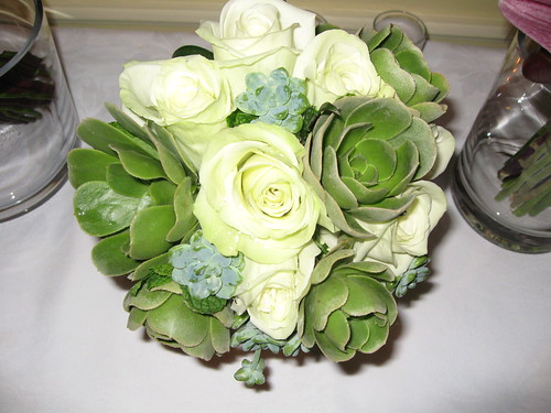 white rose bouquet with blue ribbon. plain white rose bouquet.