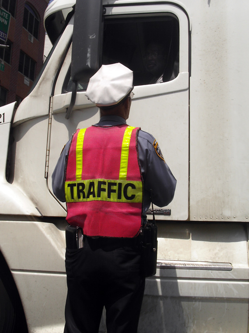 traffic cop talks to truck driver, Manhattan, NYC