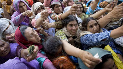 Pakistani women rush to place their orders outside of a subsidized food store on the outskirts of Islamabad.