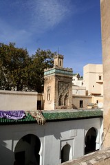 Minaret of mosque within Medersa es Saffarine by Vince Millett