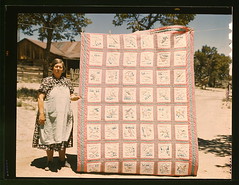 Mrs. Bill Stagg with state quilt that she made...