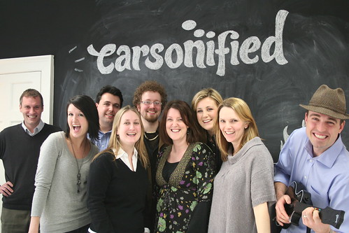 The Carsonified team acting goofy in front of the black board