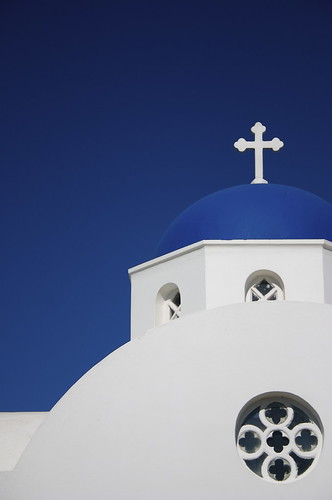 Photo of a Greek Orthodox church with a blue dome.  Santorini, Greece, June 2008.