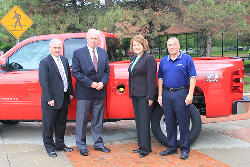 Phil Lehmkuhler, USDA Rural Development Indiana State Director, David Howell, VP Indiana Corn Marketing Council, Judy Canales, and  Nick Kassanos, Assistant Plant Manager of Fort Wayne Assembly, pose in front of a 2011 Flex-Fuel Chevrolet Silverado HD.