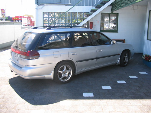 It is a 1995 Subaru Legacy station wagon, automatic, with a sunroof and a 