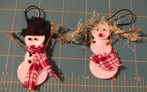 snow people with hangers