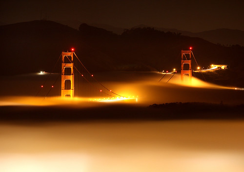 the golden gate bridge at night. The Golden Gate Bridge rising