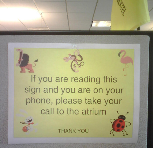 If you are reading this sign and you are on your phone, please take your call to the atrium.