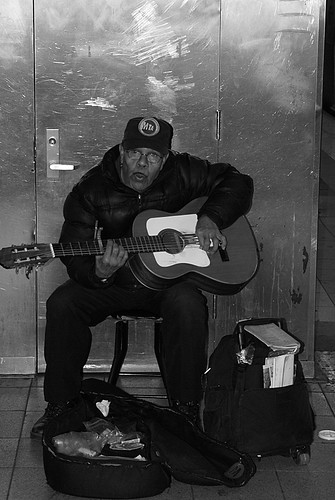 Frank singing/whistling and playing guitar at 59th street