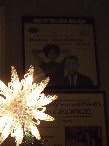 The star on top of the tree along with inspiration on the wall
