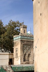 Minaret of mosque within Medersa es Seffarine by Vince Millett