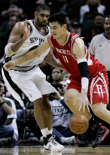 Yao Ming drives to the hole against San Antonio's Tim Duncan on Friday night in a game the Rockets lost 90-84 in San Antonio.  Yao had a sub-par game, scoring only 14 points on 7-of-16 shooting and turning the ball over 7 times, but he did grab 9 rebounds and block 3 shots.  But boards and blocks don't really matter because the Rockets have now lost 3 in a row.