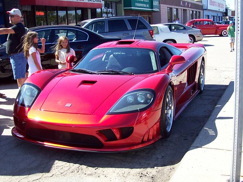 Here are two young girls whom I presume are sisters admiring a Saleen S7