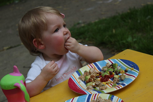 Annie eating chicken taco burgers and black bean salad