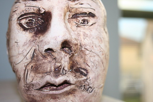 ugly face man. ugly man face sculpture/vase