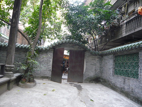Inside the family house, I look back at the main gate