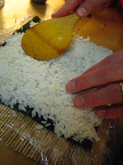 Putting on the Sushi Rice