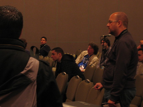 Jim Corbett in the audience in the blue and grey, talking to Colin Moock about ECMAScript 4 and ActionScript.