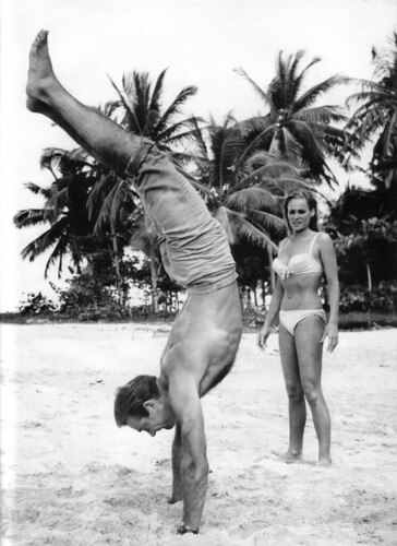 Ursula Andress watches Sean Connery performing Handstand Yoga