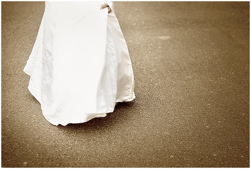 White Gown on Gray Pavement