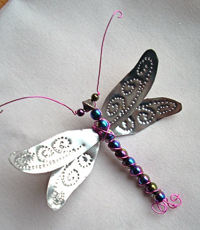 Some favorite handmade ornaments in my stash: My mom made this dragonfly, 