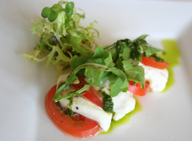 Tomato and mozzarella cheese salad with basil pesto