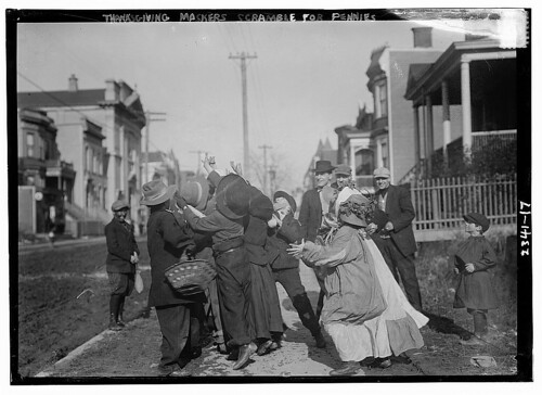 Thanksgiving Maskers scramble for pennies (LOC)