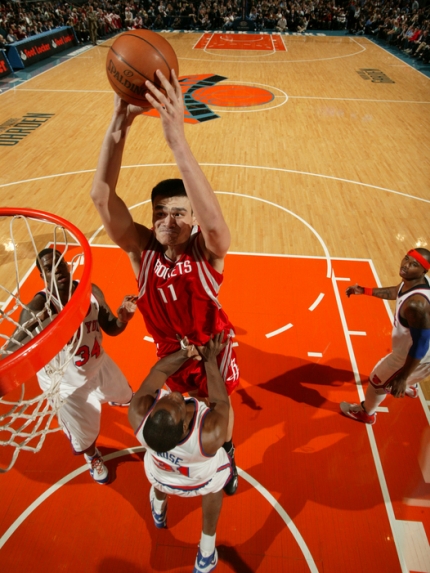 Yao Ming elevates to throw down a massive dunk over New York's Malik Rose on his way to scoring 36 points on 14-of-21 shooting, 7-of-8 from the line, and 11 rebounds to lead Houston to a 101-92 victory over the Knicks.