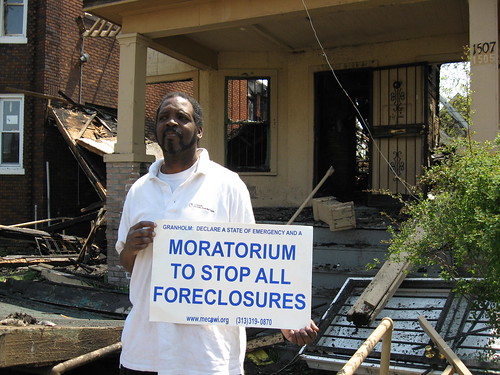 Supporter of a moratorium on foreclosures in Michigan standing outside a home that exploded on Lee Place near Woodrow Wilson on Detrot's west side, May 5, 2008. The home had been foreclosed. (Photo: Alan Pollock). by Pan-African News Wire File Photos