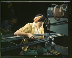 A Girl Riveting Machine Operator