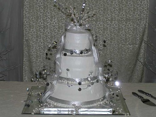 silver on white wedding cake
