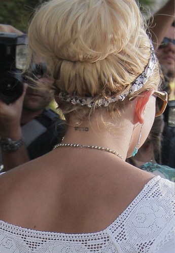 And friends are saying Brit had the tattoo removed to express the tailspin 