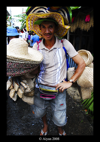 Lucban Quezon Pahiyas festival hat vendor poses for a picture street peddler  Buhay Pinoy Philippines Filipino Pilipino  people pictures photos life Philippinen      