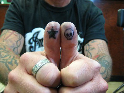 Thumb Skull and Star tattoo by Jon Poulson by Las Vegas Tattoos by Jon 