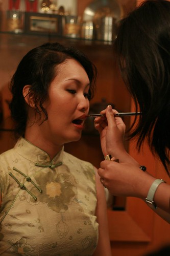 Eunice applying make-up on Kimmy