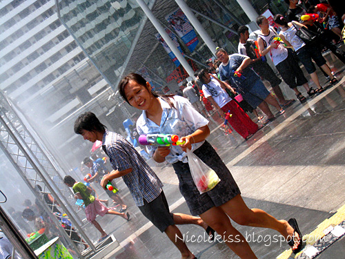 girl with water gun at water festival bangkok