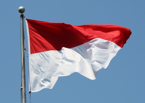 The Indonesian flag, with the red symbolizing bravery, and the white 