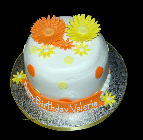 orange and yellow flowered small birthday cake