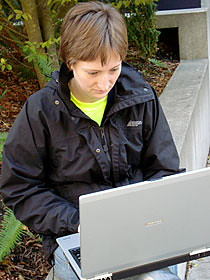 A UBC student enjoying wireless outdoors.