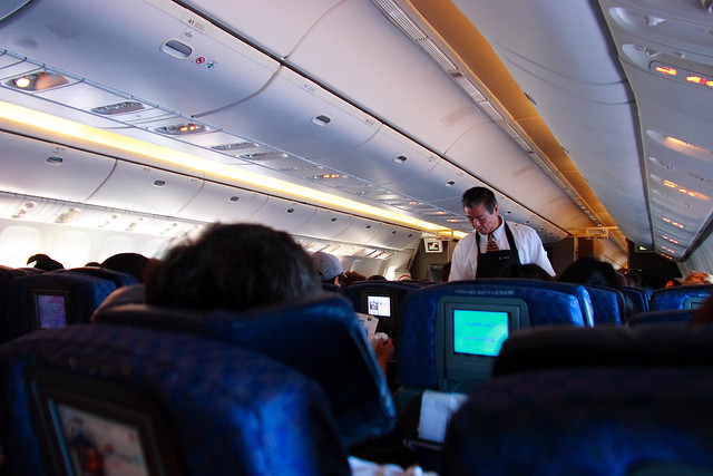 Flight Attendant and Interior of American Airlines Boeing 777