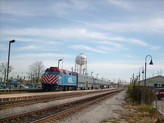 An eastbound Metra commuter local slows down for the station stop in Franklin Park Illinois. October 2007.
