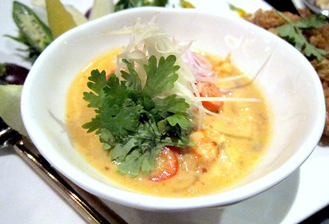 Lon gung jom naem duay kai fuu buu (Preserved fresh water prawn simmered in fresh coconut cream with lemongrass, white turmeric and chili served with deep-fried crispy egg and hand-picked crab meat)