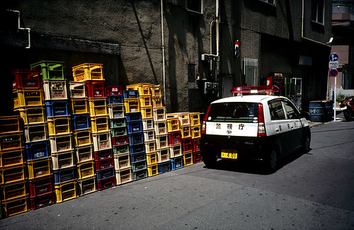 Police car and colorful boxes
