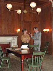 Mrs. Bush and Director Frank Milligan discuss Lincoln's love of literature in the library at President Lincoln's Cottage.