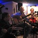 (l o r):  GMF tutors Dave Mitchell (guitar), Guillermo Rozenthuler (vocals/guitar) and Felix Gibbons (percussion) perform in La Bodeguita Azul, El Palasiet