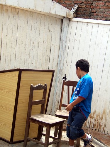 A Young Boy Plays in Front of the Pulpit.